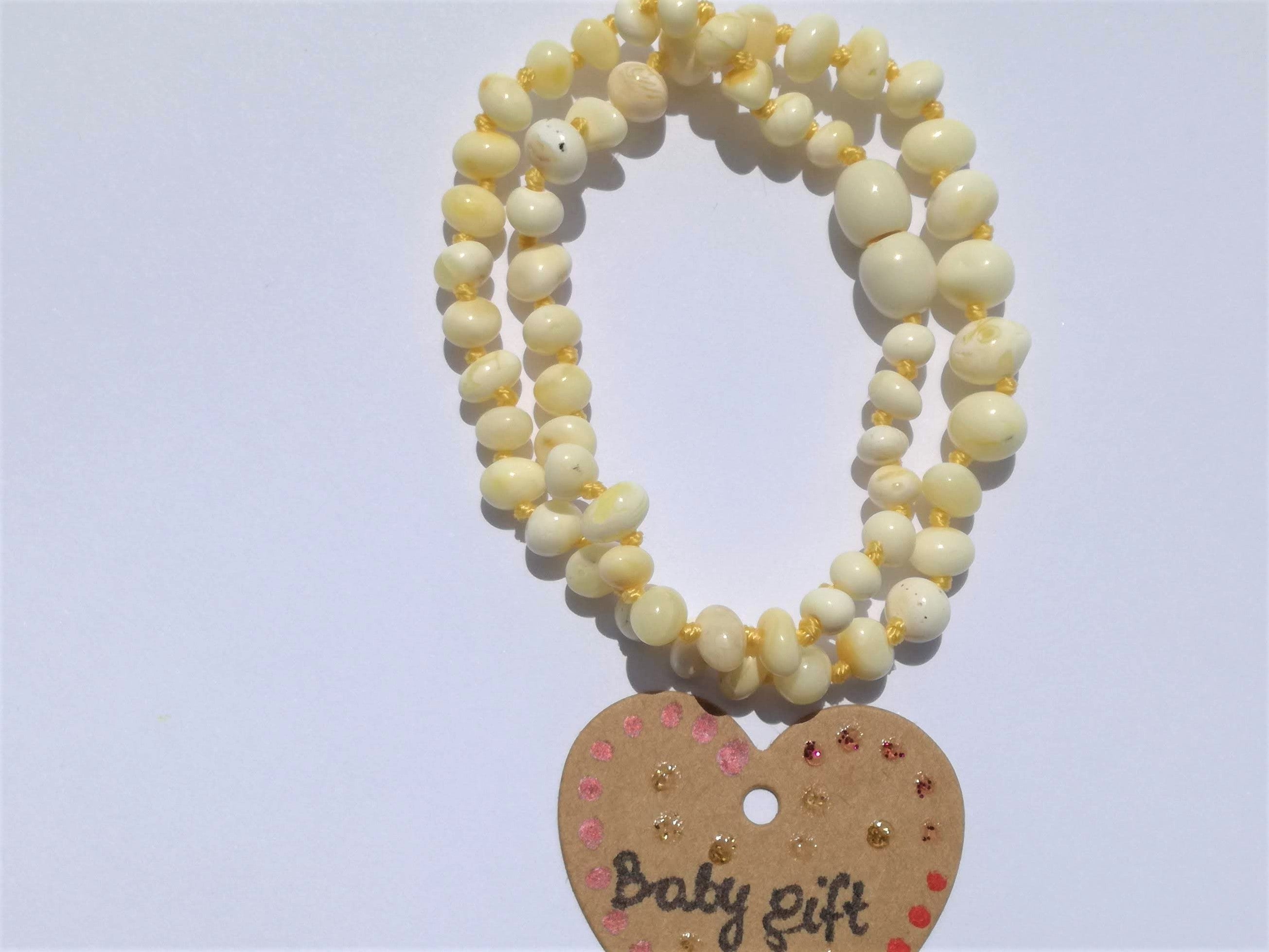 amber teething necklace, white polished beads, premium product, limited edition, plastic screw clasp, healing, succinic acid, genuine baltic amber, safe for babies and nursing mums, made in poland